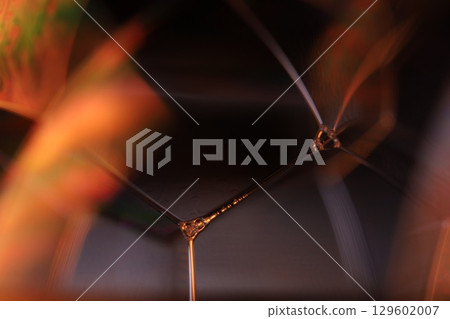 Orange coloured liquid surface, fluid effect, bright chemistry, geometric shapes 129602007