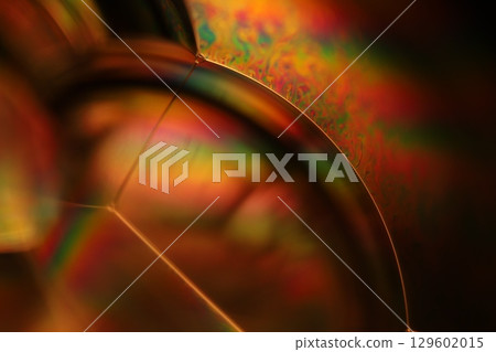 Orange coloured liquid surface, fluid effect, bright chemistry, geometric shapes Orange coloured liquid surface, fluid effect, bright chemistry, geometric shapes 129602015