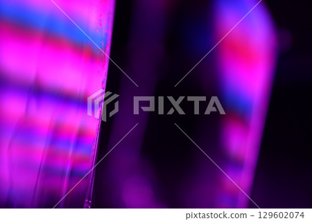 Purple liquid edge on black background Purple liquid edge on black background 129602074