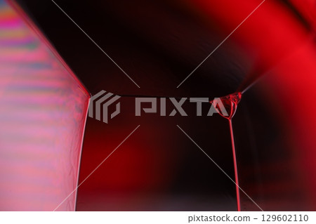 Red reflections of liquid in macro, red liquid surface, bubbles in macro, connection of bubbles in macro, cell from liquid, horror background, glossy surface panels Red reflections of liquid in macro, red liquid surface, bubbles in macro, connection of bubbles in macro, cell from liquid, horror background, glossy surface panels 129602110