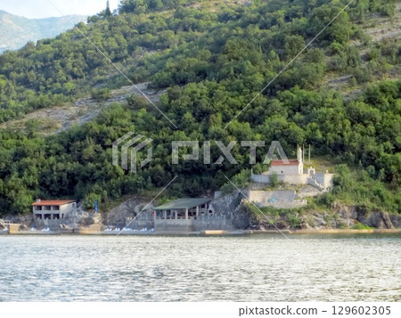 Refreshing Moments by Skadar Lake at a Charming Restaurant in Montenegros Natural Beauty Refreshing Moments by Skadar Lake at a Charming Restaurant in Montenegros Natural Beauty 129602305