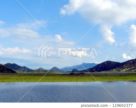 Breathtaking Views of Skadar Lake in Montenegro With Lush Greenery and Distant Mountains 129602377