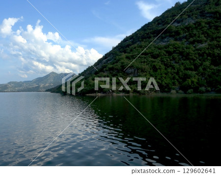 Breathtaking Reflections of Nature Along the Tranquil Shores of Skadar Lake in Montenegro Breathtaking Reflections of Nature Along the Tranquil Shores of Skadar Lake in Montenegro 129602641