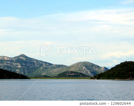Exploring the Tranquil Beauty of Skadar Lake in Montenegro Surrounded by Majestic Mountains Exploring the Tranquil Beauty of Skadar Lake in Montenegro Surrounded by Majestic Mountains 129602644