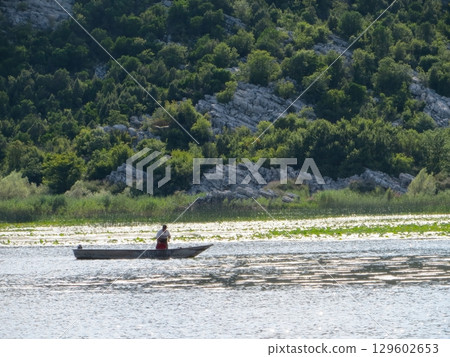 Exploring the Tranquil Beauty of Skadar Lake in Montenegro During a Peaceful Fishing Trip Exploring the Tranquil Beauty of Skadar Lake in Montenegro During a Peaceful Fishing Trip 129602653