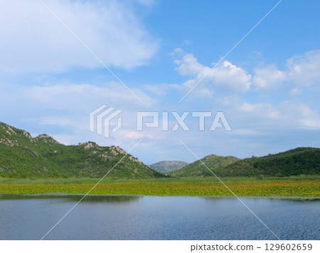 Breathtaking Views of Skadar Lake in Montenegro Showcasing Natures Beauty During a Serene Day 129602659