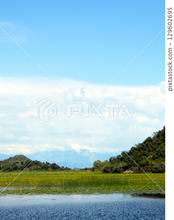 Explore the Serene Beauty of Skadar Lake Nestled Between Lush Mountains in Montenegro Explore the Serene Beauty of Skadar Lake Nestled Between Lush Mountains in Montenegro 129602695