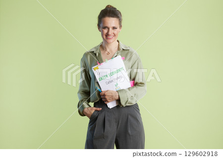Positive Green Economy: Confident Woman with Folder Positive Green Economy: Confident Woman with Folder 129602918