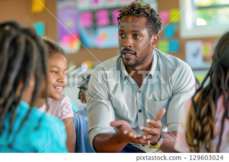 Teacher Engages with Attentive Children in Classroom Setting 129603024