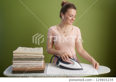 Gentle ironing with a soft smile Gentle ironing with a soft smile 129603234