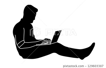 Silhouette of a man sitting on the floor and using a laptop Silhouette of a man sitting on the floor and using a laptop 129603387