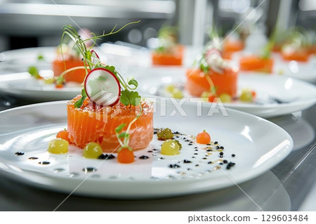 Gourmet Salmon Tartare Plated with Modern Gastronomy in Restaurant Setting 129603484