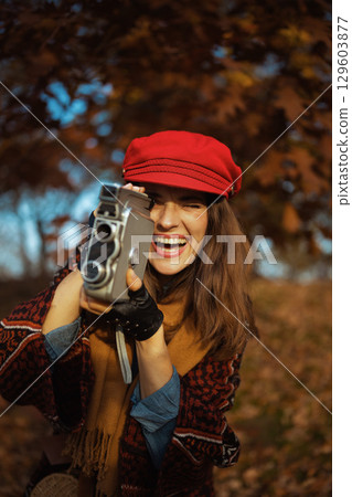 happy trendy 40 years old woman in red hat happy trendy 40 years old woman in red hat 129603877