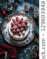 Festive Christmas Cake with Ornaments, Pinecones, and Holiday Decorations on Dark Background 129603948