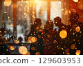 Festive Holiday Party with Sparkling Lights and Silhouetted People 129603953