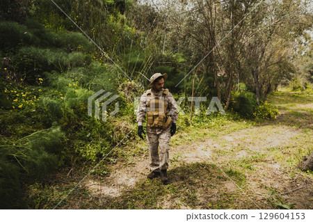 Soldier Looking Around In Search For Something Soldier Looking Around In Search For Something 129604153