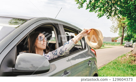 Car trip family. Parents child vehicle. Journey countryside freedom sunlight. Car trip family. Parents child vehicle. Journey countryside freedom sunlight. 129604373