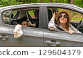 Driving car trip. Family road vehicle. Summer countryside stop adventure. 129604379