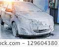 Car washing. Car cleaning soap foam. Spray bubbles pressure wet shine. 129604380