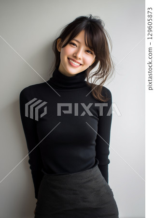 A smiling woman in a black turtleneck - a portrait that combines purity and intimacy 129605873