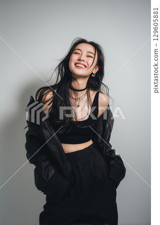 Free-spirited smiles and black individuality: portraits of Gen Z with a street vibe 129605881