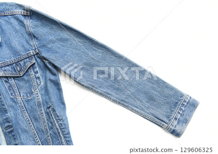 sleeve of blue denim shirt texture isolated on white background, jean fashion style sleeve of blue denim shirt texture isolated on white background, jean fashion style 129606325