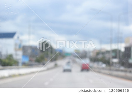 highway traffic with safety barrier on road asphalt, blurred image highway traffic with safety barrier on road asphalt, blurred image 129606336
