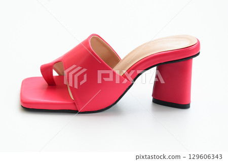beautiful pink leather heel shoe isolated on white background beautiful pink leather heel shoe isolated on white background 129606343