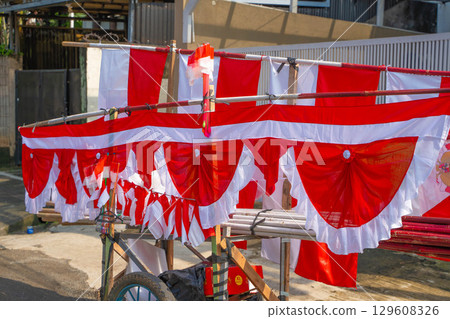 A food stall selling red and white flags celebrating Indonesian Independence Day A food stall selling red and white flags celebrating Indonesian Independence Day 129608326