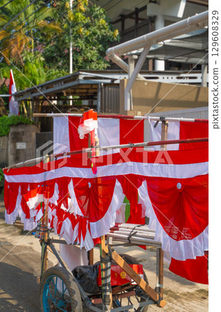 A food stall selling red and white flags celebrating Indonesian Independence Day 129608329