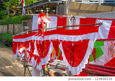 A food stall selling red and white flags celebrating Indonesian Independence Day 129608330