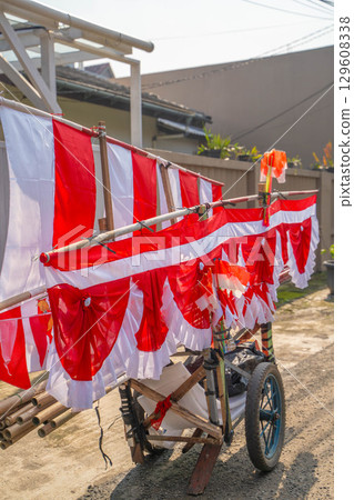 A food stall selling red and white flags celebrating Indonesian Independence Day 129608338