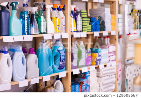 Assortment of toilet, kitchen and window cleaning products in the household goods department of supermarket 129608667
