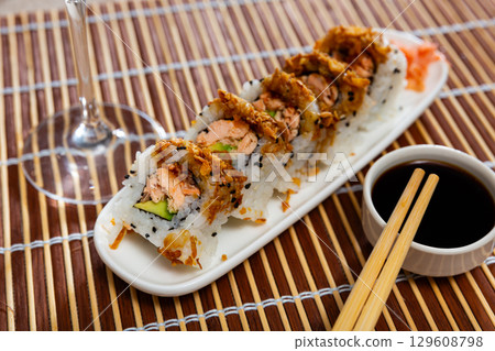 Set of rolls with fish and vegetables with Chinese chopsticks Set of rolls with fish and vegetables with Chinese chopsticks 129608798