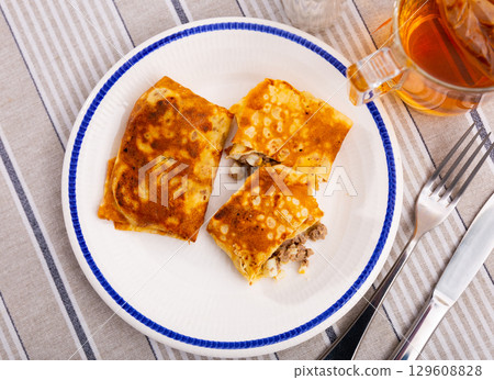Delectable pancakes, featuring filling of minced liver and eggs, perfect for next breakfast Delectable pancakes, featuring filling of minced liver and eggs, perfect for next breakfast 129608828