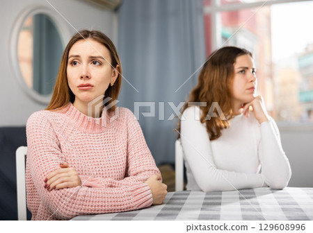 Two sisters do not want to communicate after domestic quarrel at home Two sisters do not want to communicate after domestic quarrel at home 129608996