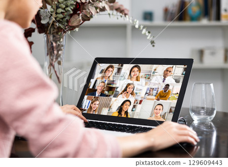 Young woman holding a video conference online on internet 129609443