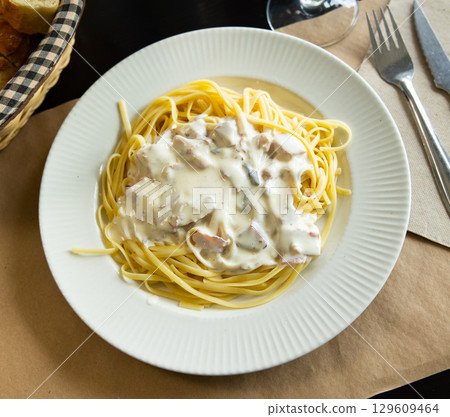 Tagliatelle pasta carbonara italian, with tangliatelle spaghetti, egg and parmesan cheese 129609464