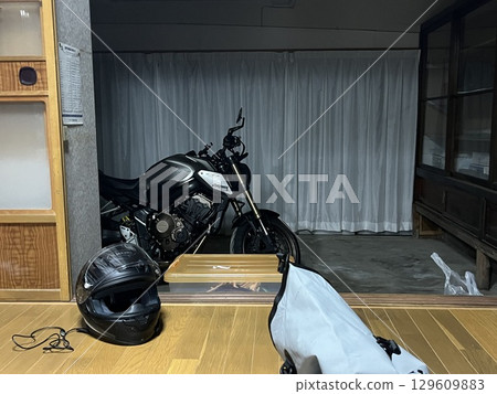Storing a motorcycle in an old house 129609883