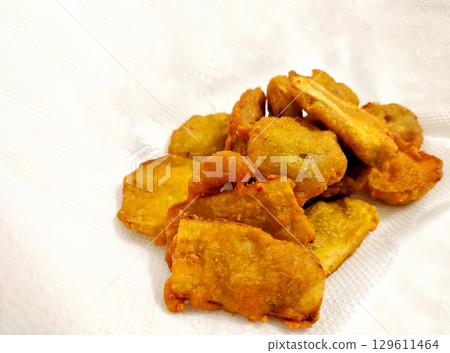 Banana Fritters Served with Spicy Red Chutney 129611464