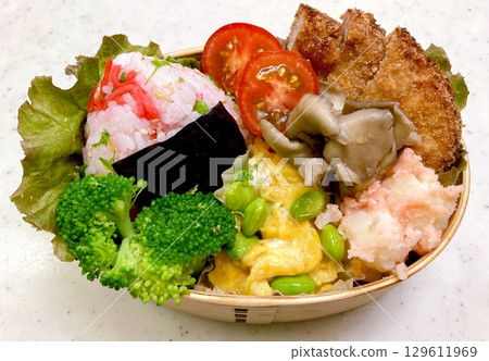 A traditional Korean dosirak, beautifully arranged with rice, assorted banchan, and savory proteins. Balanced and visually inviting, its a portable meal packed with vibrant flavors. 129611969