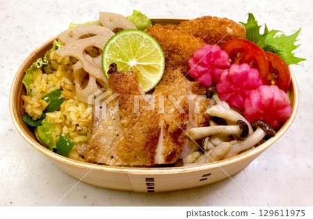 A traditional Korean dosirak, beautifully arranged with rice, assorted banchan, and savory proteins. Balanced and visually inviting, its a portable meal packed with vibrant flavors. 129611975