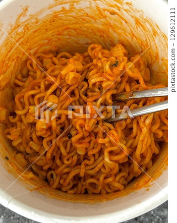 Spicy buldak ramyeon with fiery hot sauce and chewy noodles, delivering an intense, flavorful kick in every bite. A perfect choice for those who crave bold, spicy Korean comfort food. Spicy buldak ramyeon with fiery hot sauce and chewy noodles, delivering an intense, flavorful kick in every bite. A perfect choice for those who crave bold, spicy Korean comfort food. 129612111