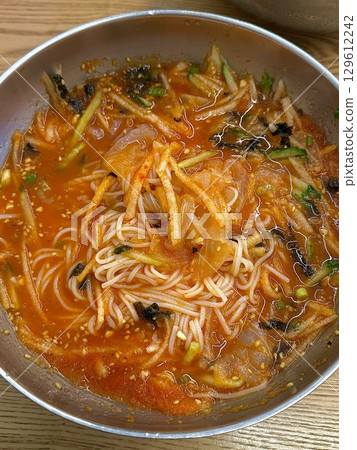 Fresh and refreshing Hanwoo mulhoe with tender beef, chilled broth, and crisp vegetables. A must-try Korean dish for those seeking a cool, light, and flavorful dining experience. Fresh and refreshing Hanwoo mulhoe with tender beef, chilled broth, and crisp vegetables. A must-try Korean dish for those seeking a cool, light, and flavorful dining experience. 129612242