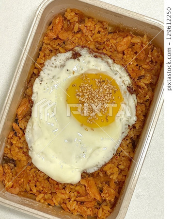 A traditional Korean dosirak, beautifully arranged with rice, assorted banchan, and savory proteins. Balanced and visually inviting, its a portable meal packed with vibrant flavors. A traditional Korean dosirak, beautifully arranged with rice, assorted banchan, and savory proteins. Balanced and visually inviting, its a portable meal packed with vibrant flavors. 129612250