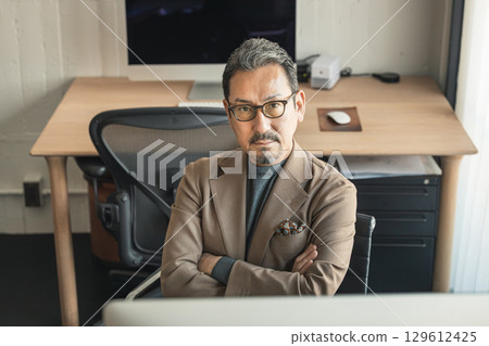 A sour middle-aged businessman A sour middle-aged businessman 129612425