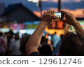People taking photos of the festival 129612746