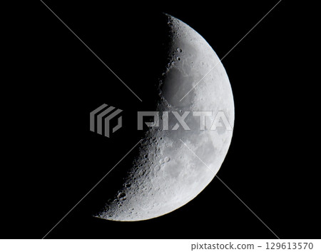 moon floating in the night sky 129613570