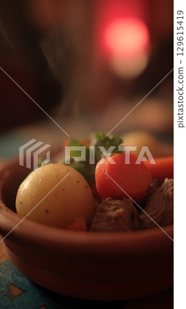 Hearty Stew Slow Cooked With Potatoes and Carrots. 129615419