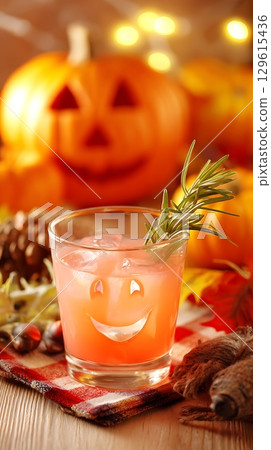 Spooky Halloween Drink with Smiling Pumpkin Backdrop. 129615436
